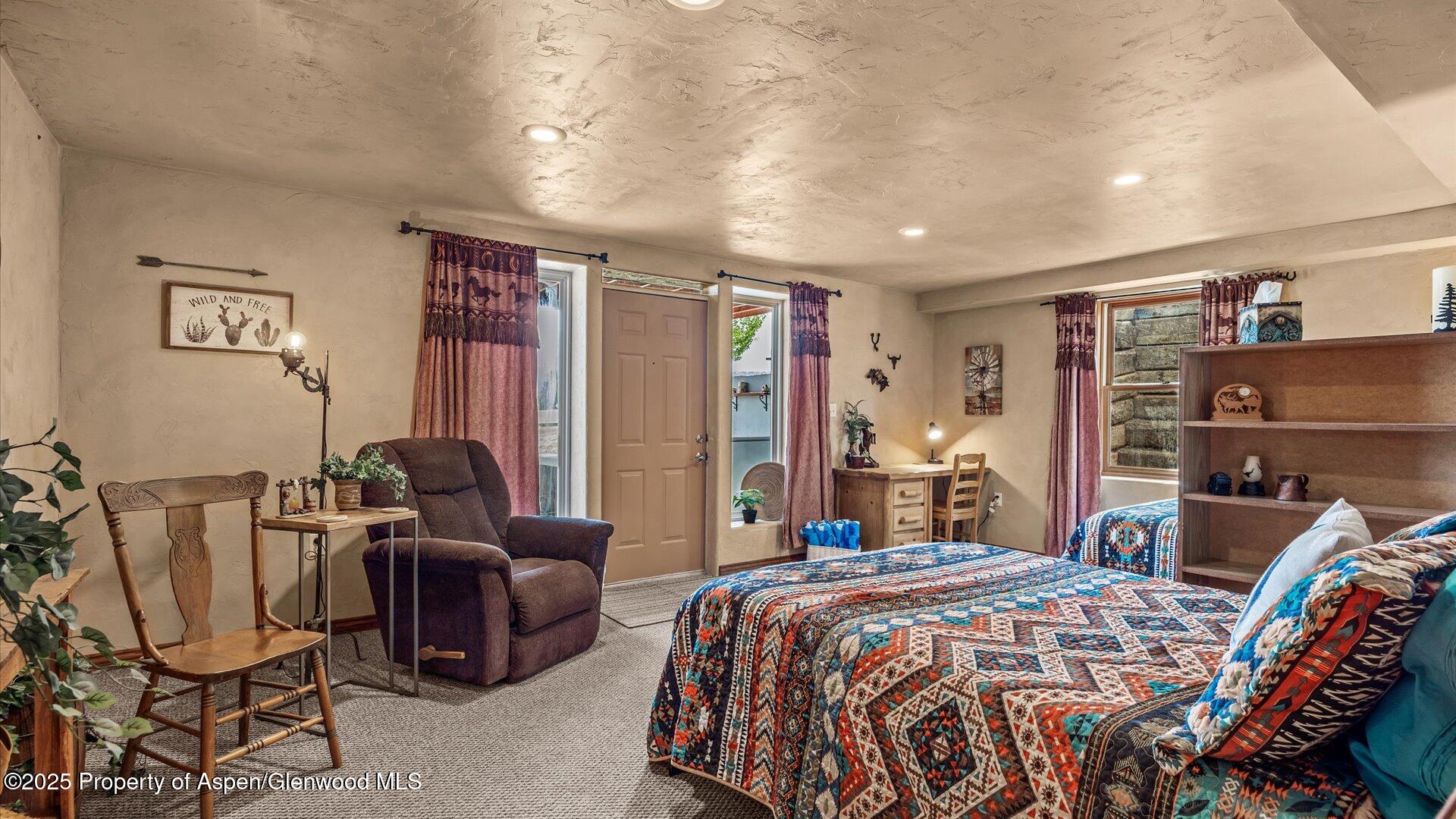 40380 D Road Crawford, CO 81415 - Photo 42 of 52 a bedroom with a bed and wooden floor