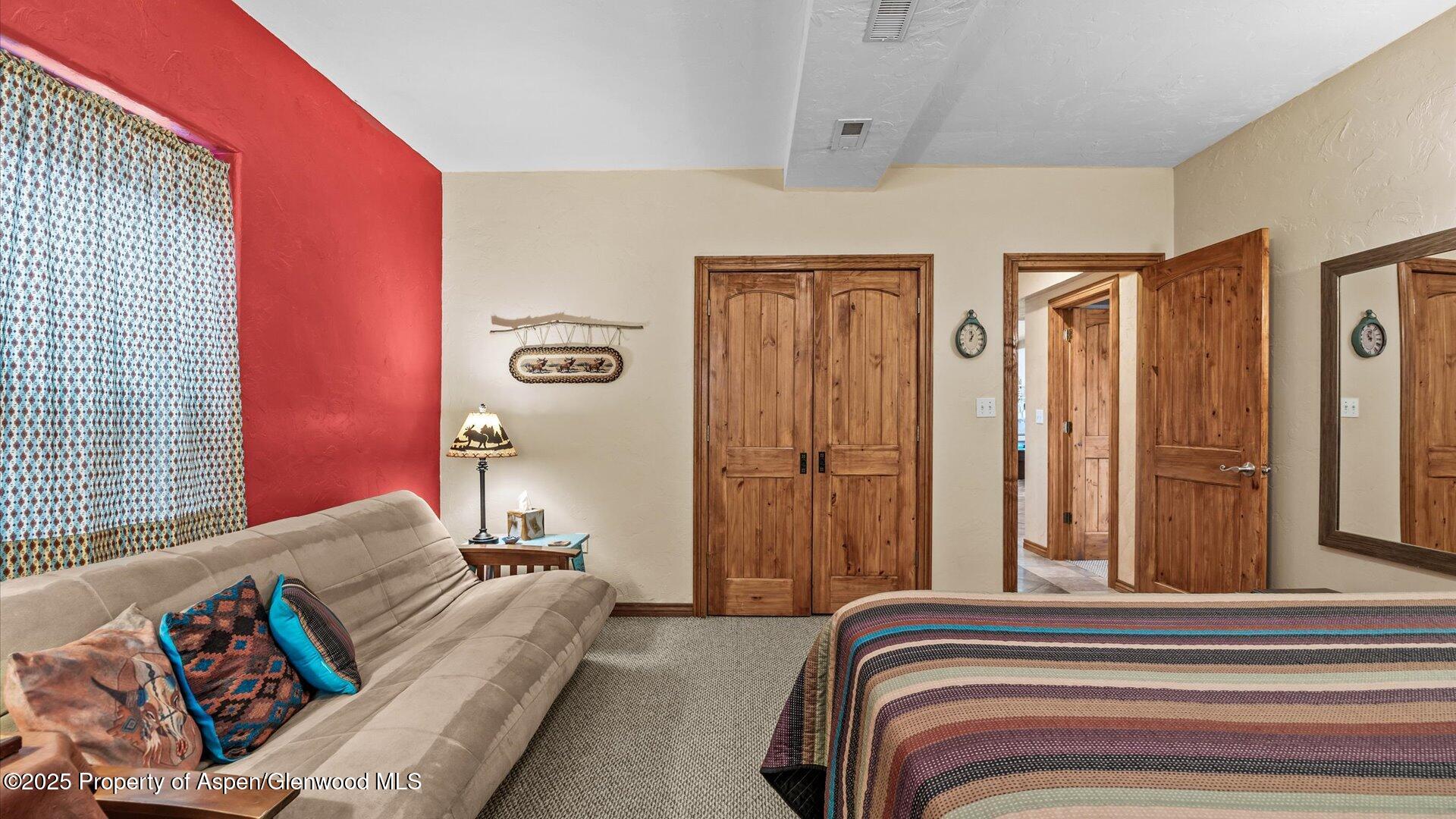 40380 D Road Crawford, CO 81415 - Photo 45 of 52 a bedroom with a bed and a couch