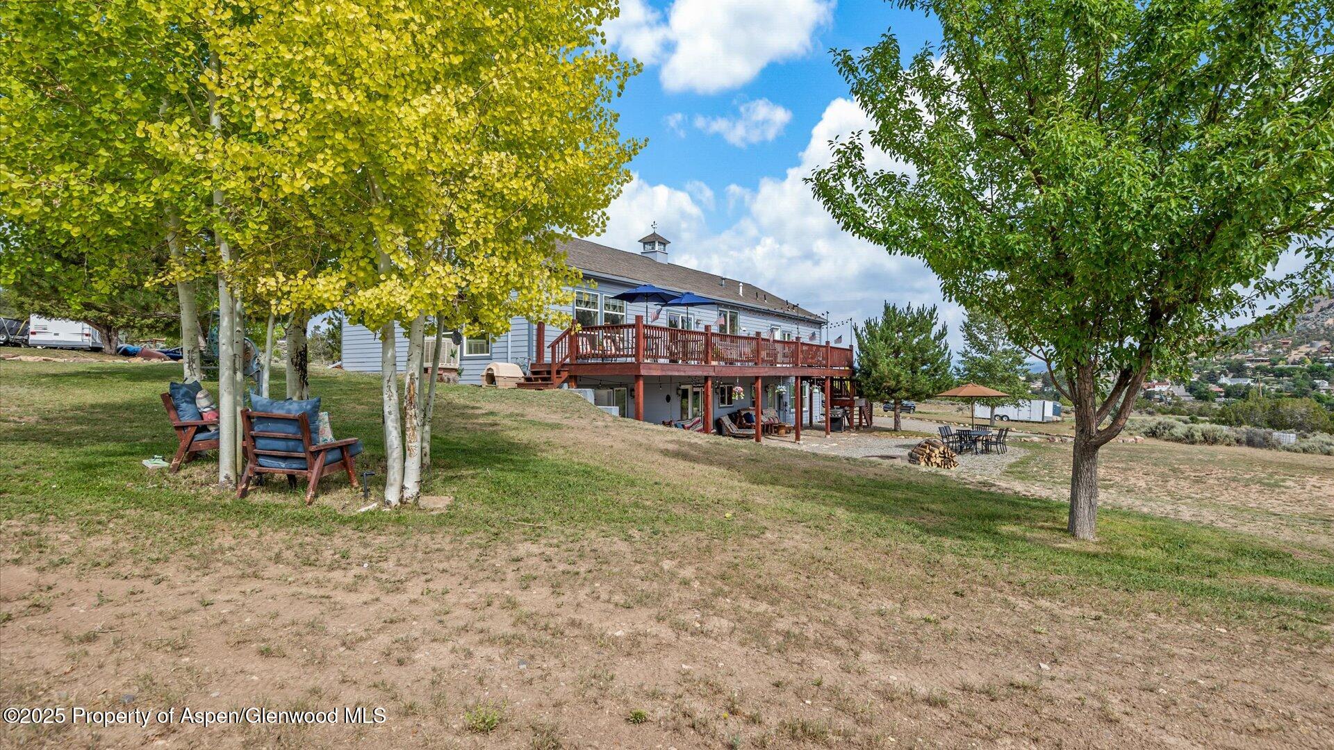 40380 D Road Crawford, CO 81415 - Photo 49 of 52 a view of a house with a yard porch and sitting area