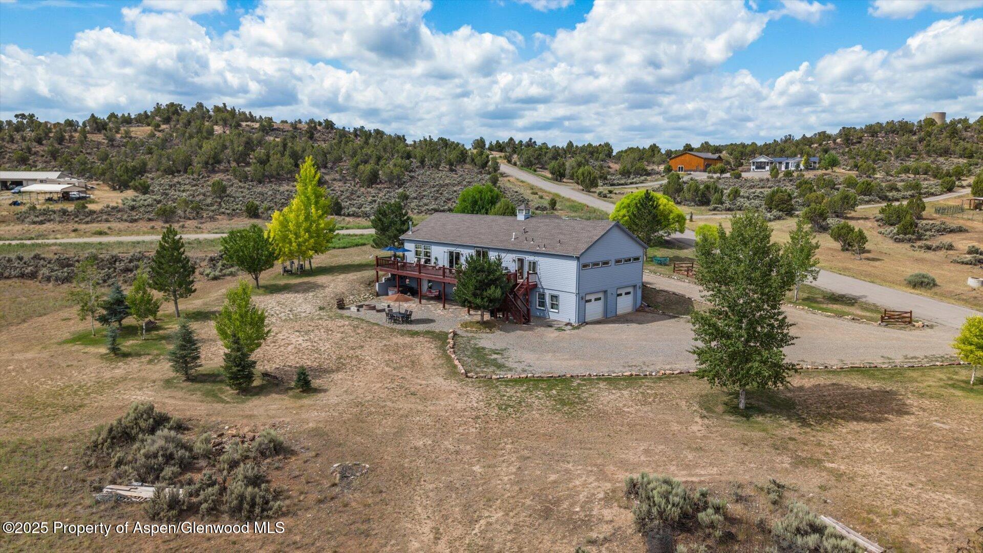 40380 D Road Crawford, CO 81415 - Photo 50 of 52 an aerial view of a house with a yard and lake view