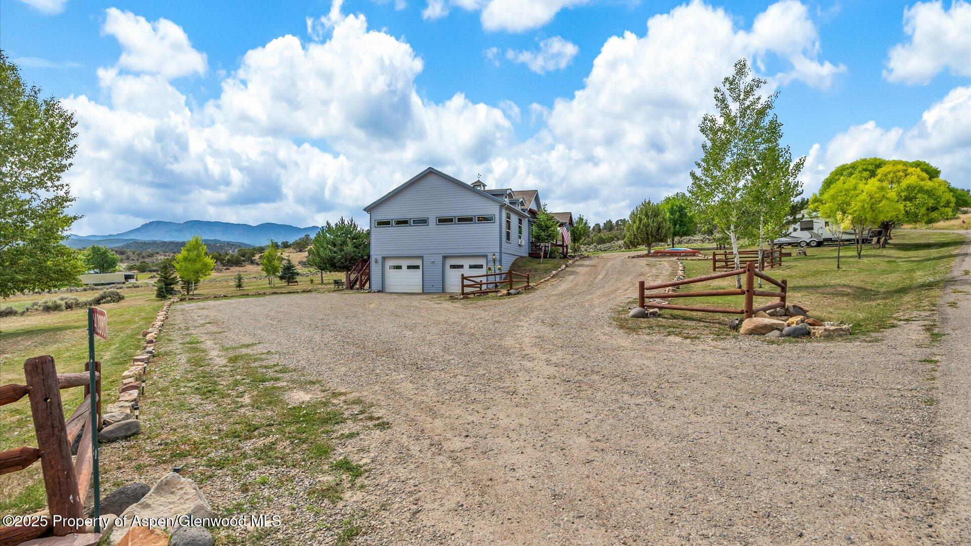 40380 D Road Crawford, CO 81415 - Photo 8 of 52 a view of a house with a yard