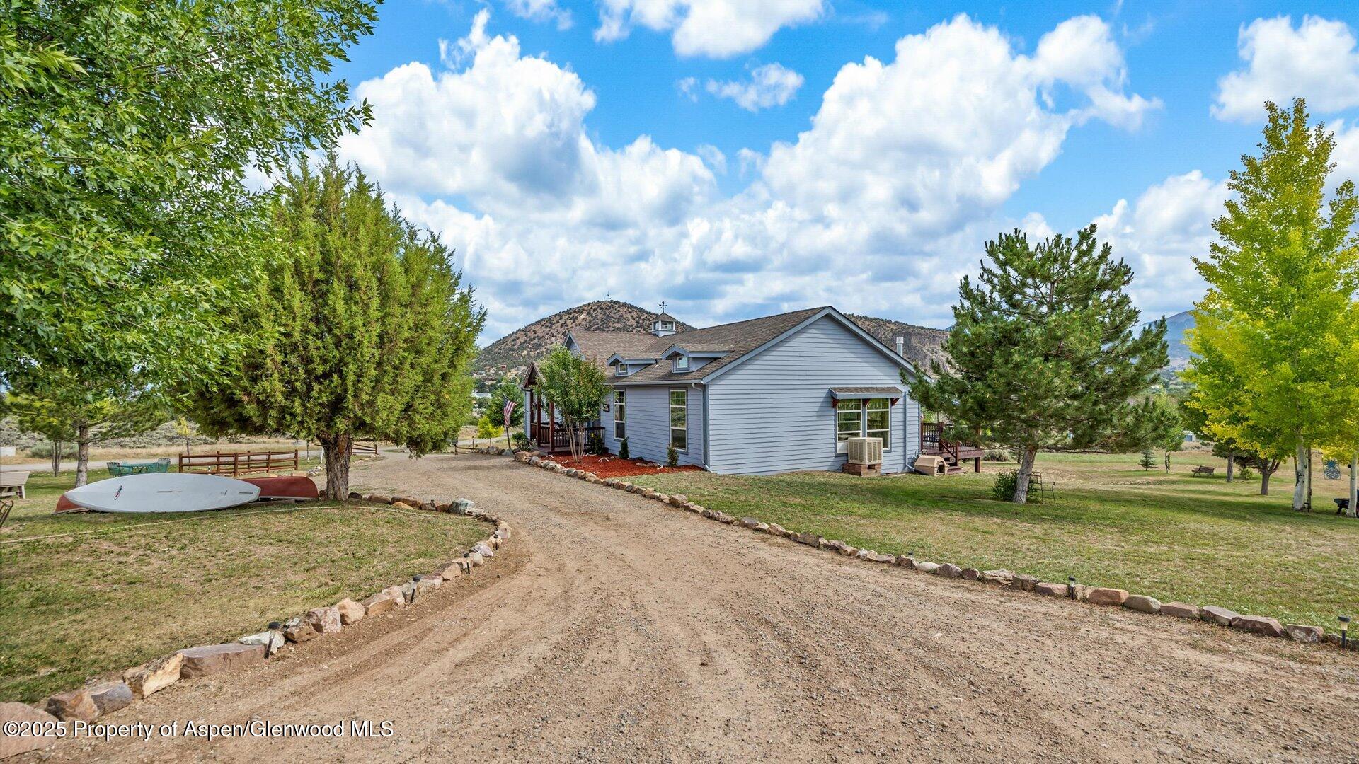 40380 D Road Crawford, CO 81415 - Photo 9 of 52 a view of a house with a yard