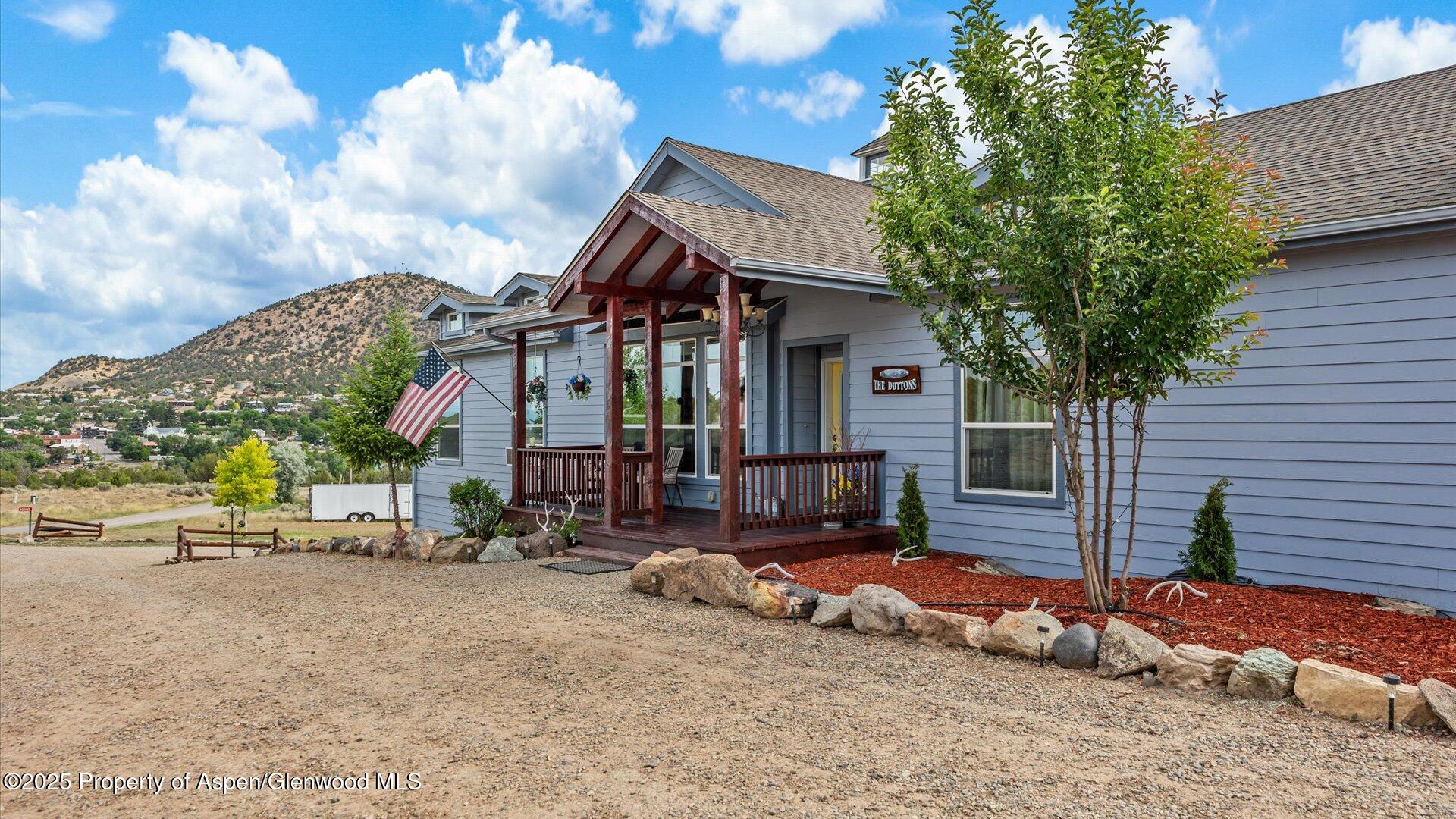 40380 D Road Crawford, CO 81415 - Photo 10 of 52 a view of a house with a yard and sitting area