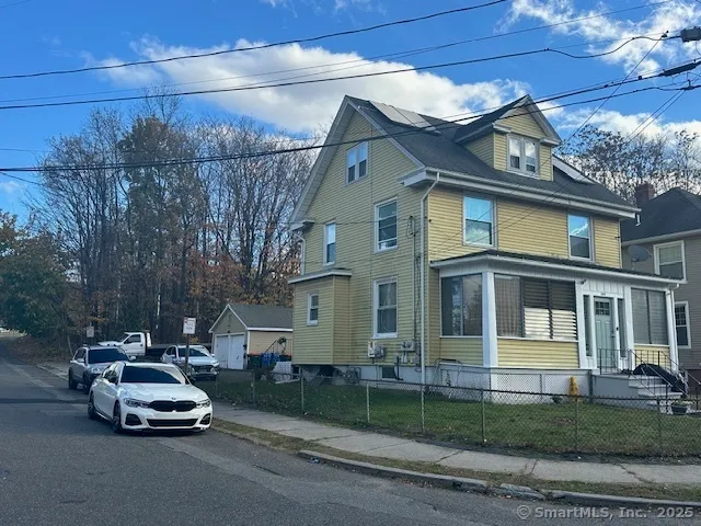 a car parked in front of a house