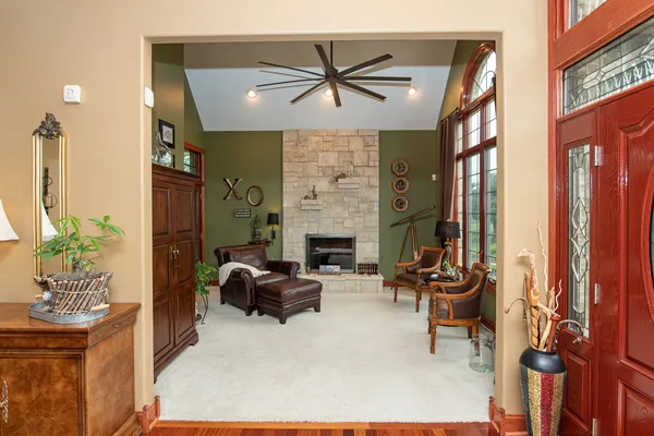 a view of a dining room with furniture chandelier and wooden floor