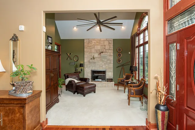 a view of a dining room with furniture chandelier and wooden floor