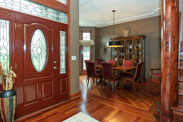 a view of entryway and hall with wooden floor