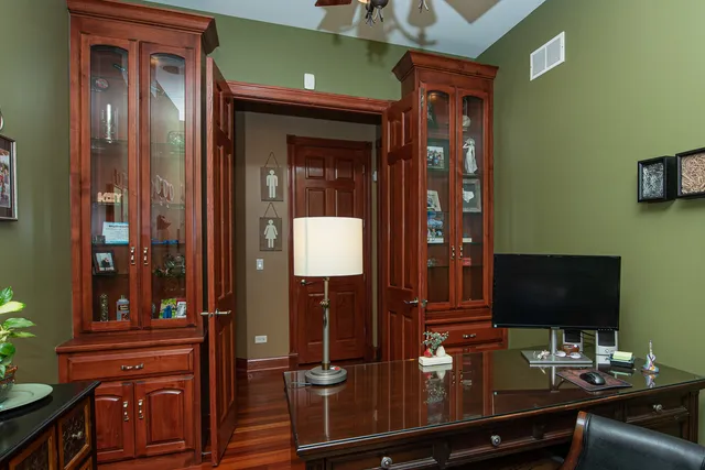 a en suite bathroom with a double vanity sink a large mirror and shower
