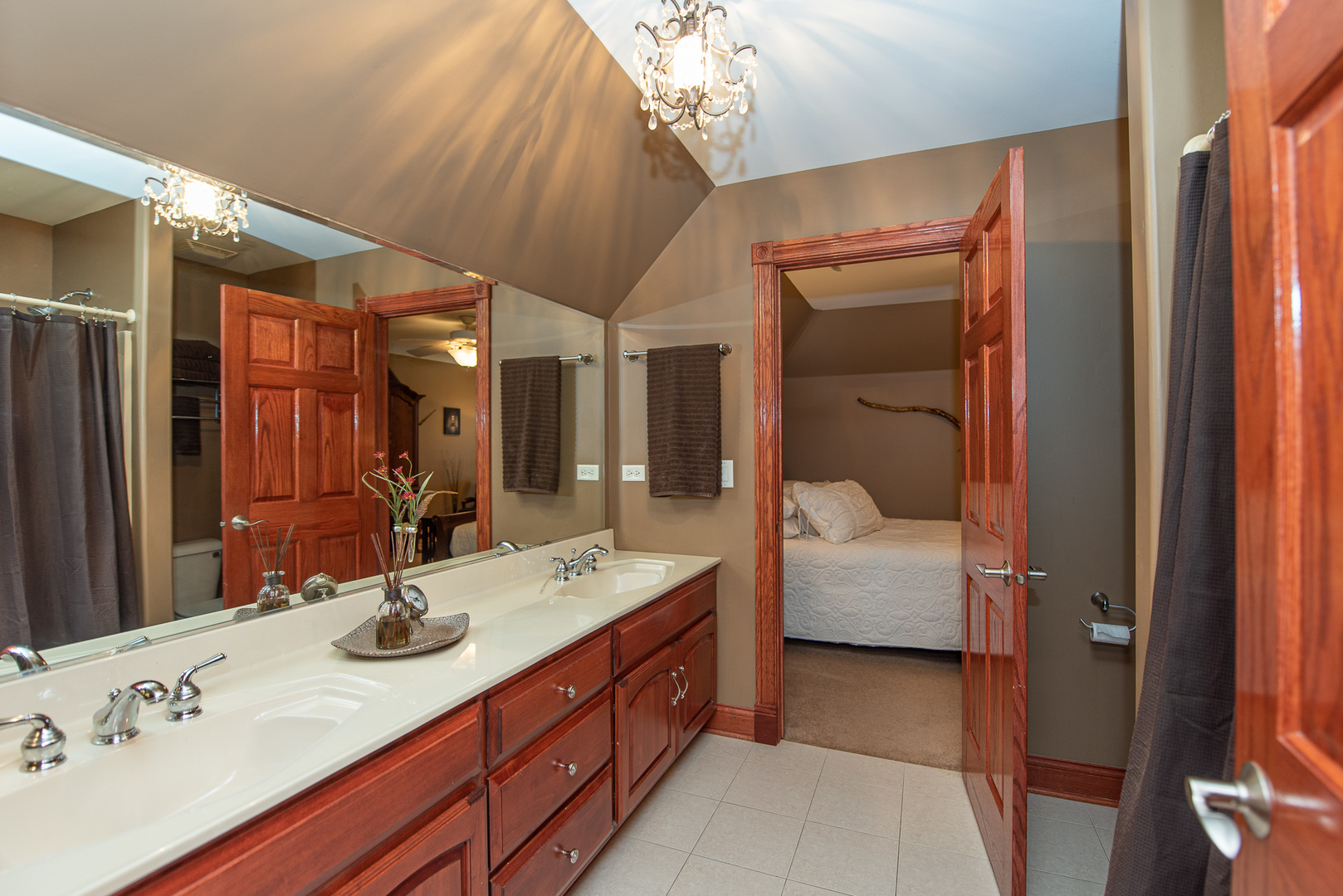 19657 West Sharp Road Elwood, IL 60421 - Photo 19 of 64 a en suite bathroom with a double vanity sink a large mirror and shower