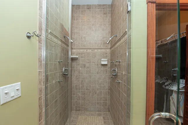 a living room with furniture and a lamp