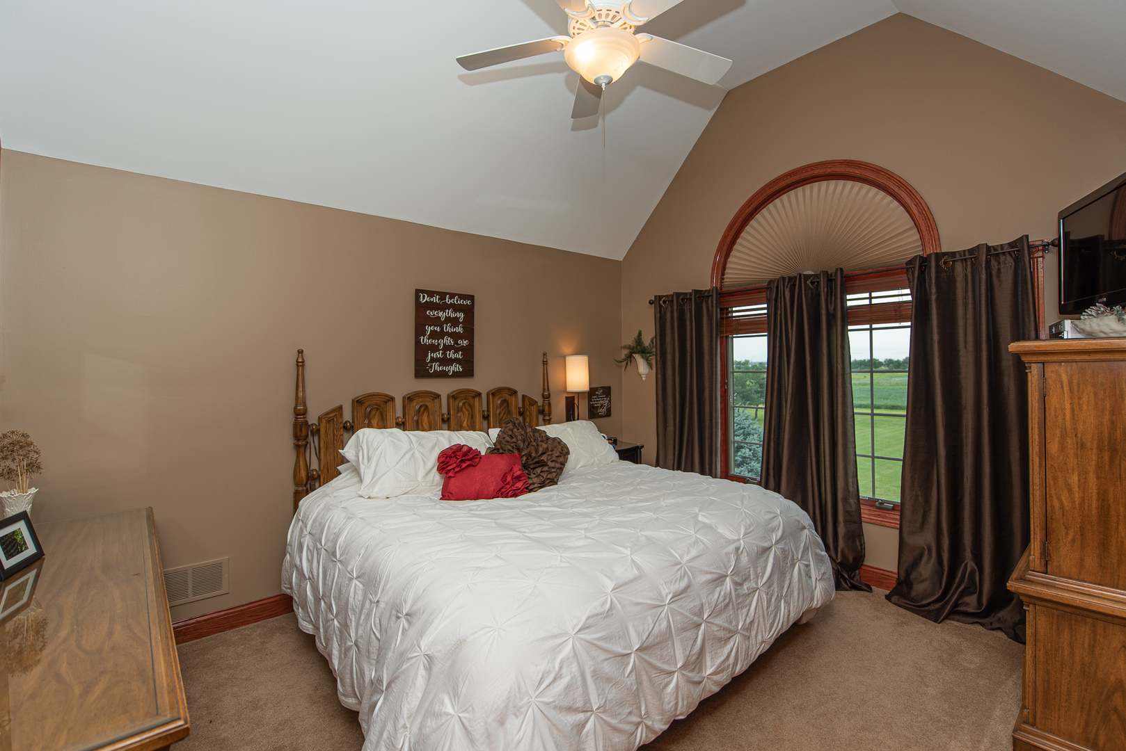 19657 West Sharp Road Elwood, IL 60421 - Photo 27 of 64 a bedroom with a large bed and a chandelier