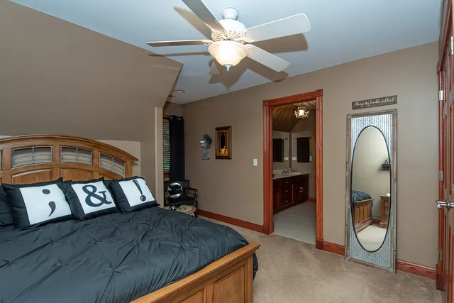 a kitchen with stainless steel appliances granite countertop a sink a stove and a wooden cabinets