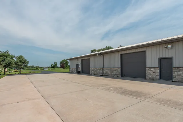 a front view of house with yard and trees