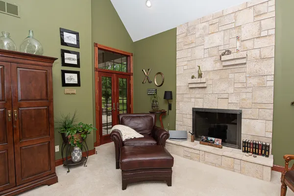 a living room with furniture and a fireplace