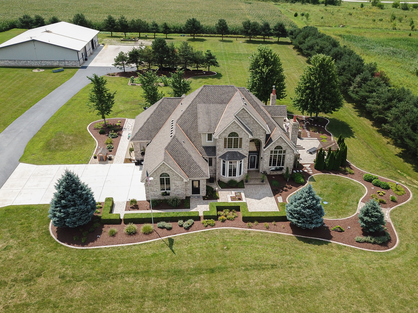 19657 West Sharp Road Elwood, IL 60421 - Photo 63 of 64 an aerial view of a house with swimming pool and lake view