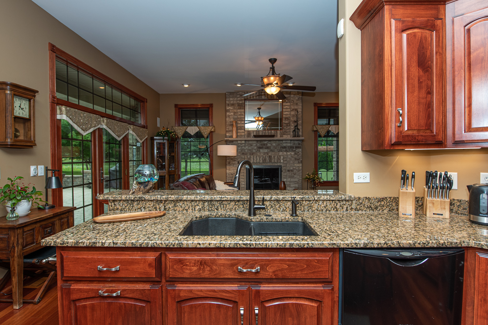 19657 West Sharp Road Elwood, IL 60421 - Photo 7 of 64 a kitchen with granite countertop a sink a counter top space and cabinets