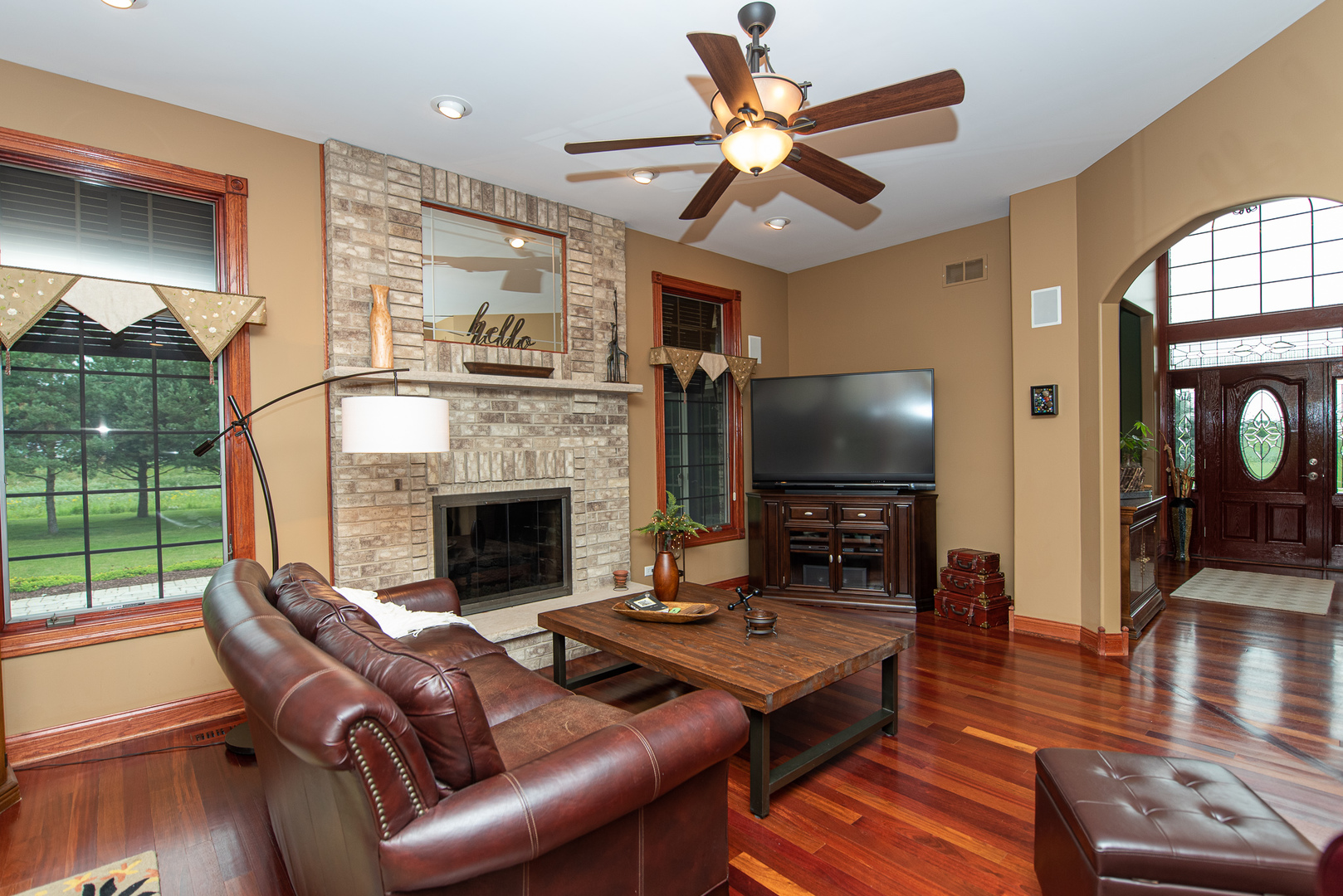 19657 West Sharp Road Elwood, IL 60421 - Photo 9 of 64 a living room with furniture a fireplace and a flat screen tv