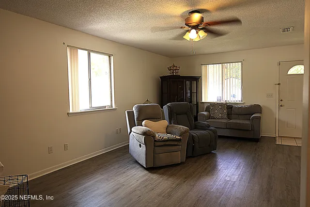 a living room with furniture and a window