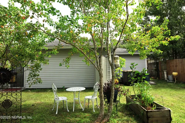 a potted plant sitting in front of a house