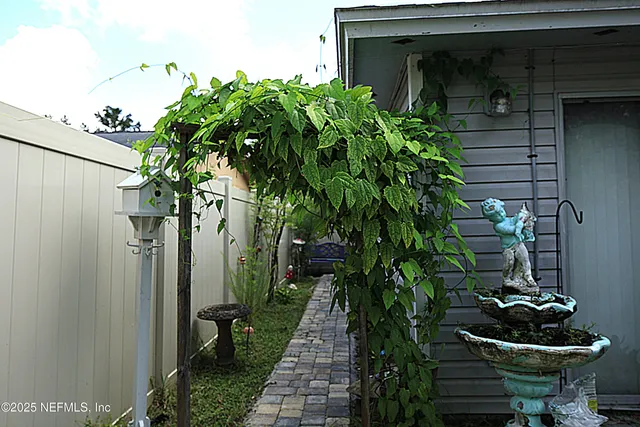 a backyard of a house with lots of green space