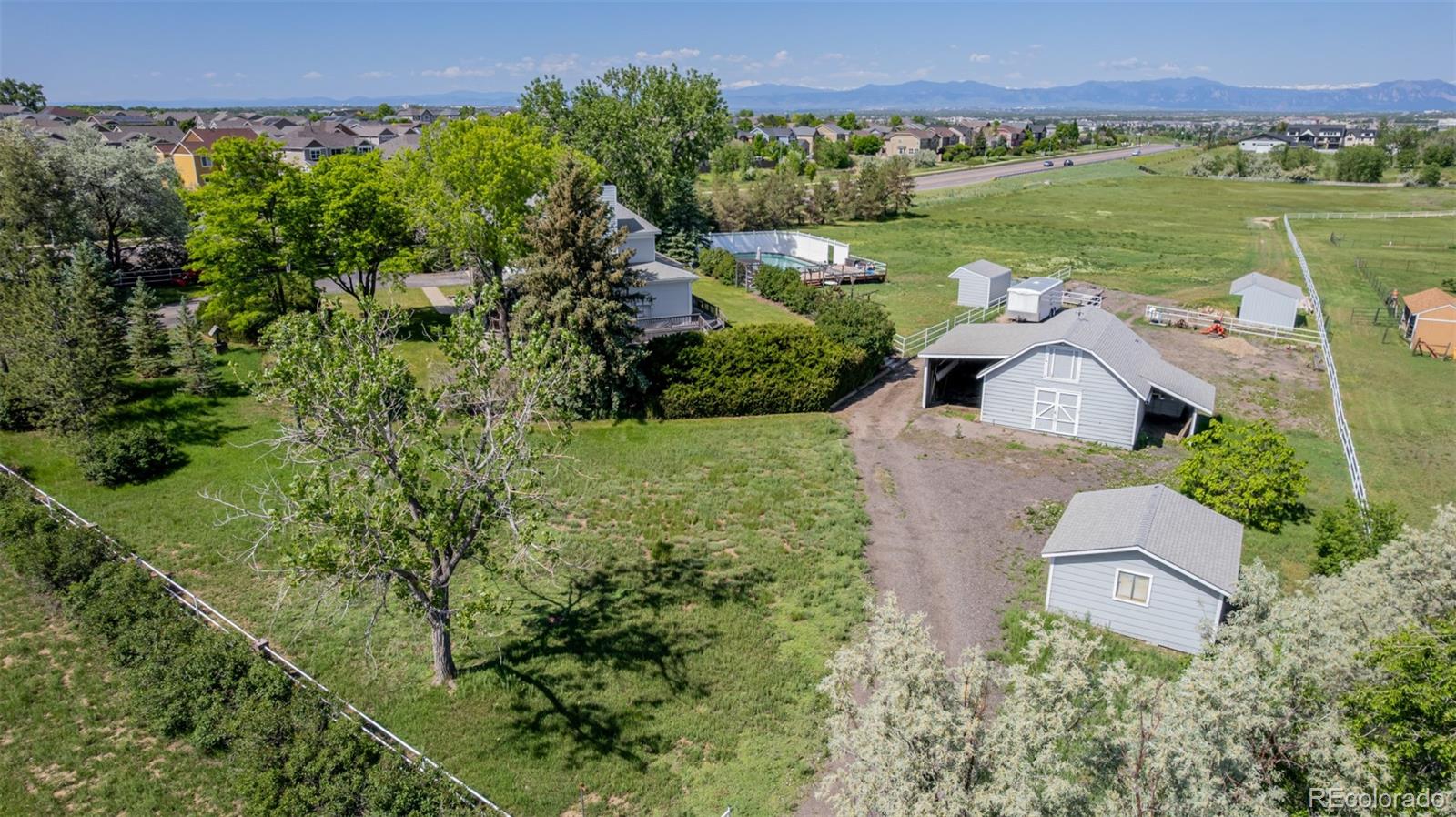 14447 Madison Street Thornton, CO 80602 - Photo 11 of 37 an aerial view of a house with a garden and yard view