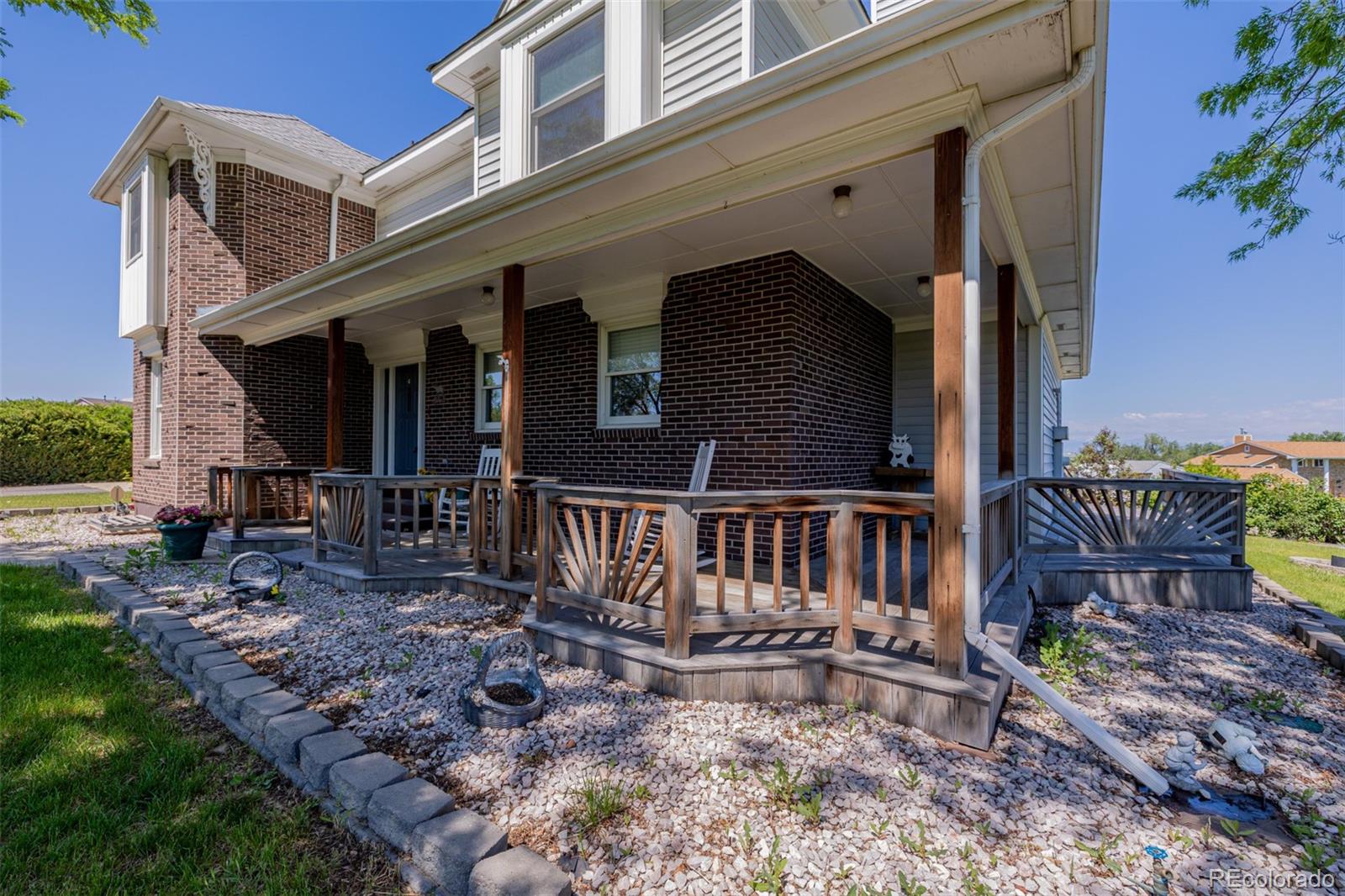14447 Madison Street Thornton, CO 80602 - Photo 13 of 37 a view of a house with backyard and porch