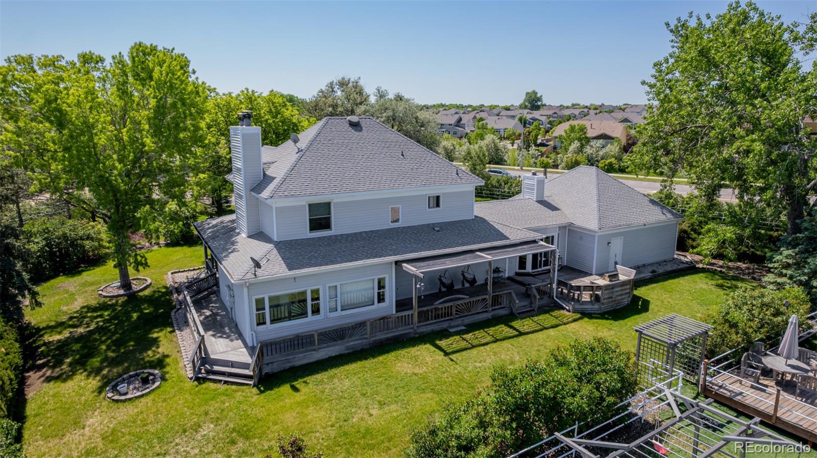 14447 Madison Street Thornton, CO 80602 - Photo 18 of 37 an aerial view of a house with a big yard