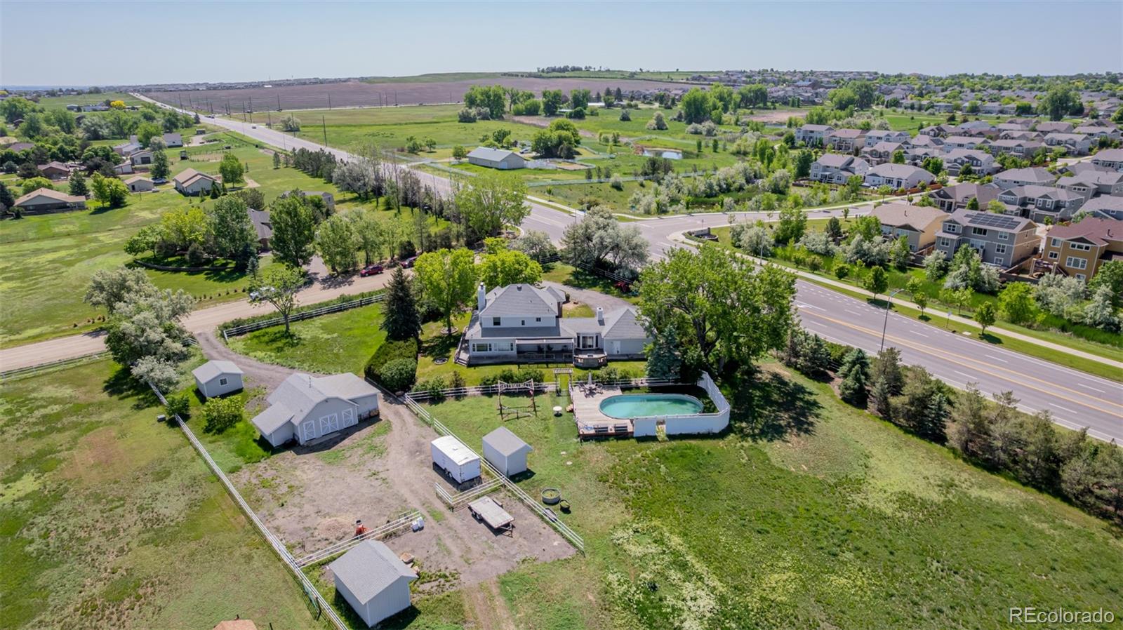 14447 Madison Street Thornton, CO 80602 - Photo 2 of 37 an aerial view of a house with a garden