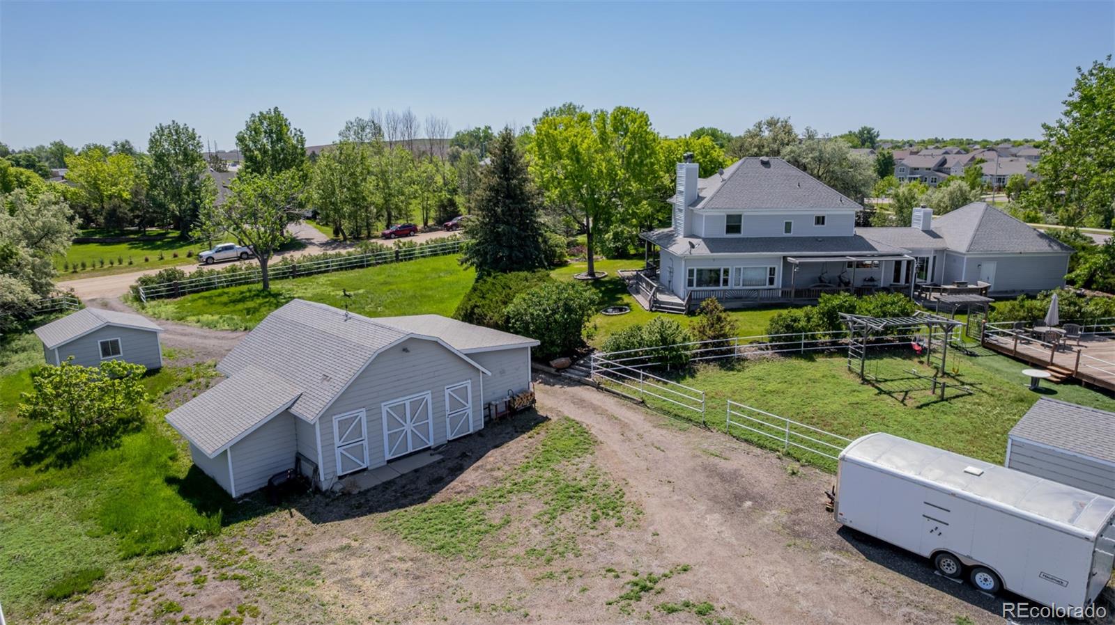 14447 Madison Street Thornton, CO 80602 - Photo 22 of 37 a view of a house with garden and a yard