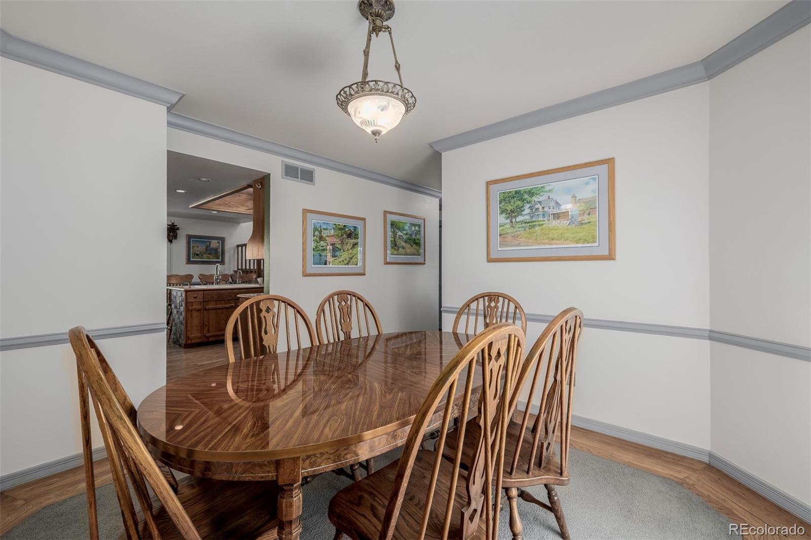 14447 Madison Street Thornton, CO 80602 - Photo 34 of 37 a view of a dining room with furniture