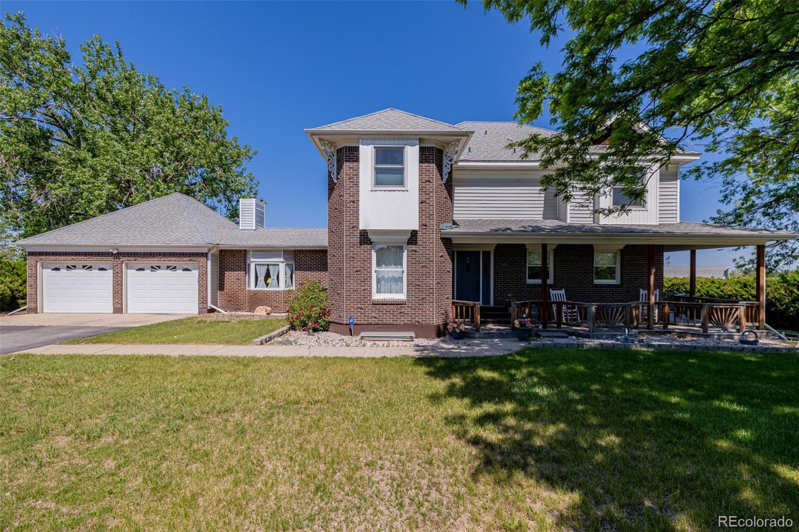 14447 Madison Street Thornton, CO 80602 - Photo 4 of 37 a front view of a house with swimming pool having outdoor seating