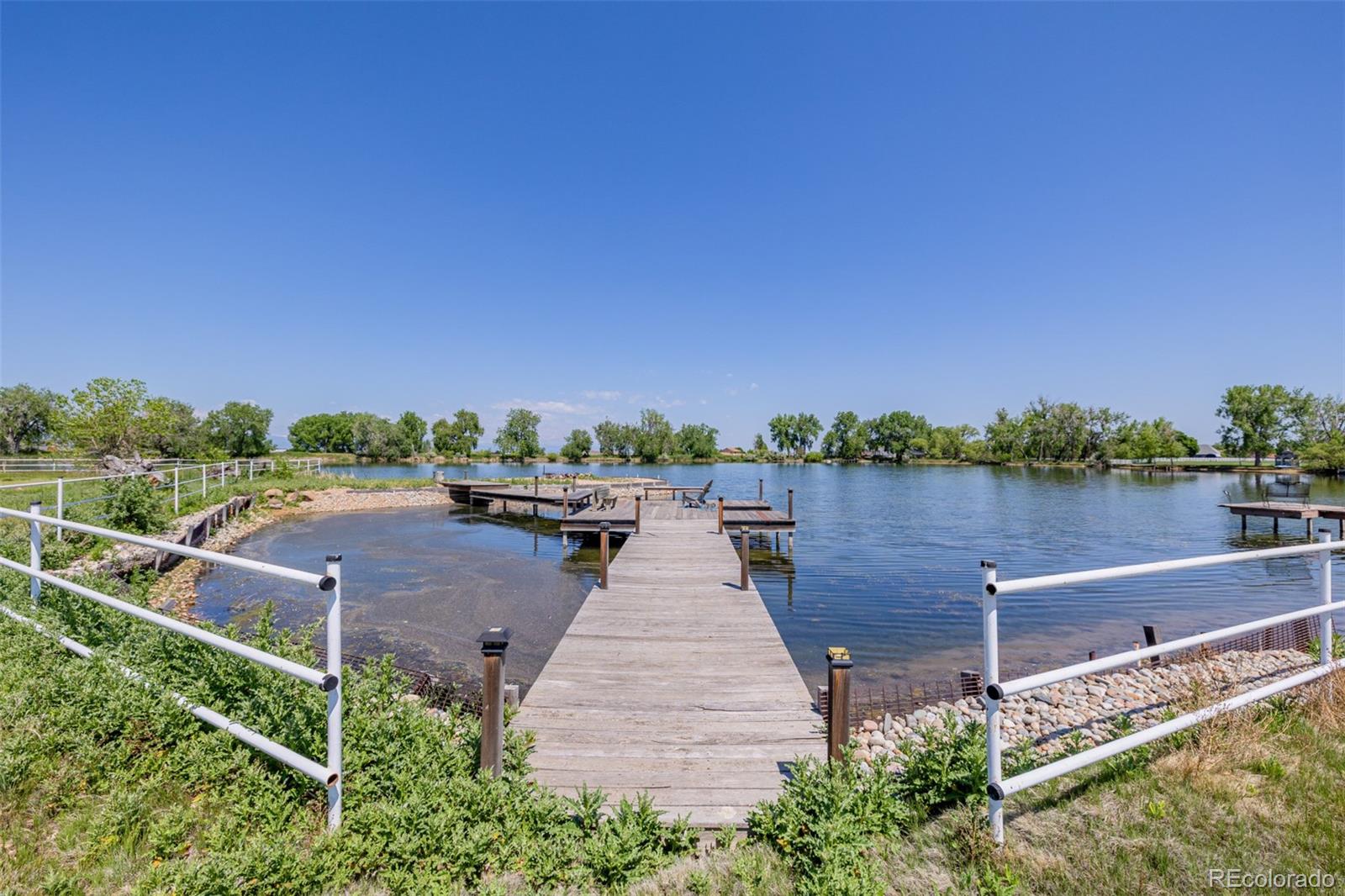 14447 Madison Street Thornton, CO 80602 - Photo 5 of 37 a view of a lake with outdoor space