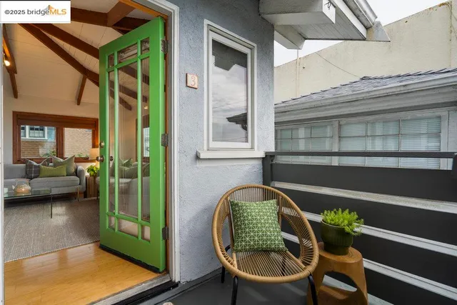 a view of a two chairs in the balcony