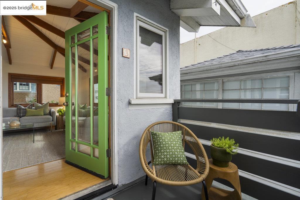 a view of a two chairs in the balcony