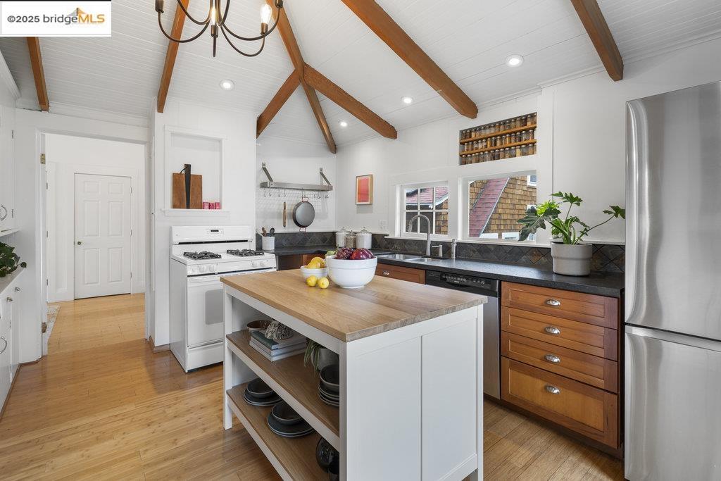 2587 Piedmont Avenue, Unit 3 Berkeley, CA 94704 - Photo 14 of 33 a kitchen that has a lot of cabinets a sink and a stove