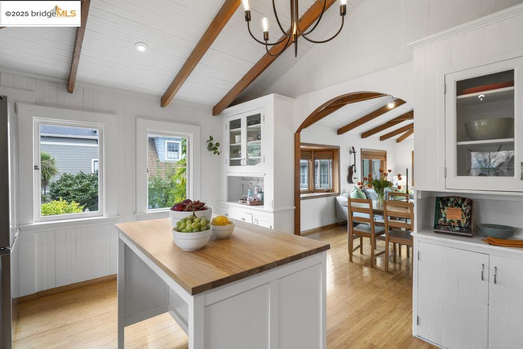 2587 Piedmont Avenue, Unit 3 Berkeley, CA 94704 - Photo 19 of 33 a kitchen with stainless steel appliances granite countertop a dining table chairs and chandelier