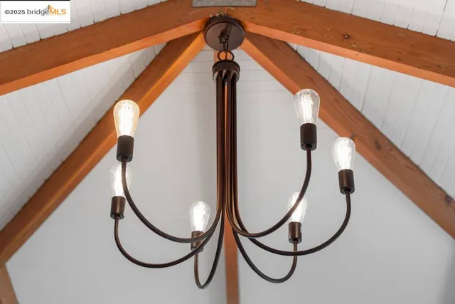 a bedroom with furniture and wooden floor