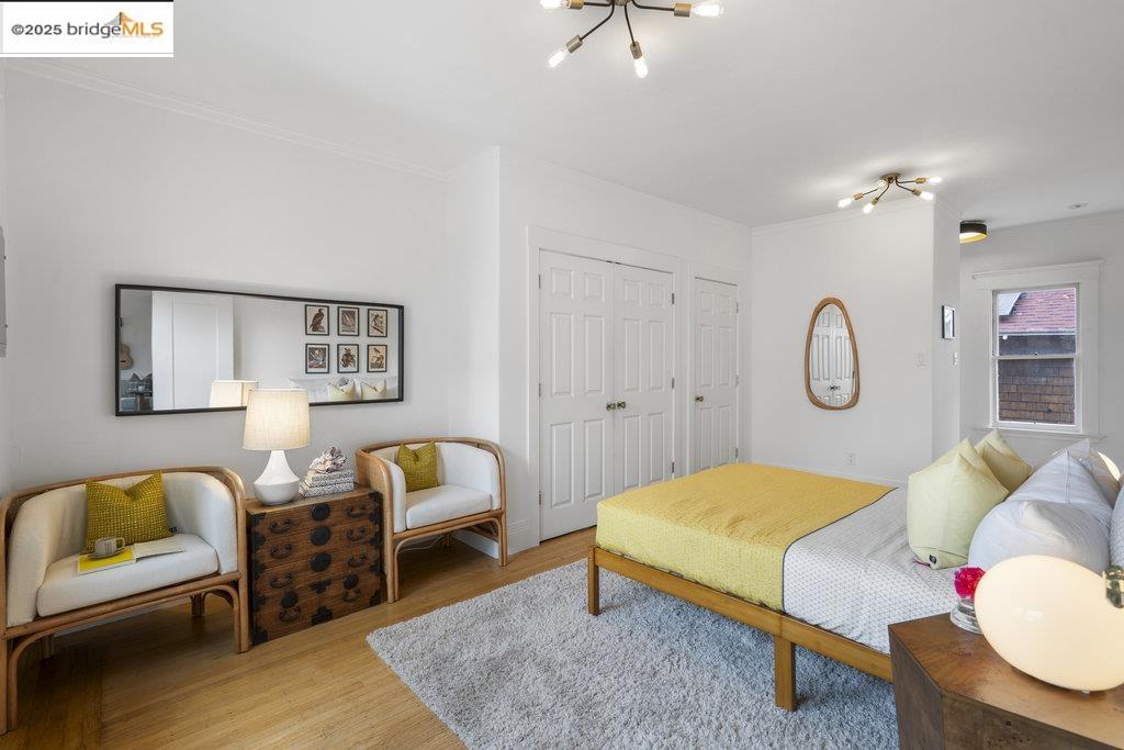 2587 Piedmont Avenue, Unit 3 Berkeley, CA 94704 - Photo 21 of 33 a bedroom with furniture and wooden floor