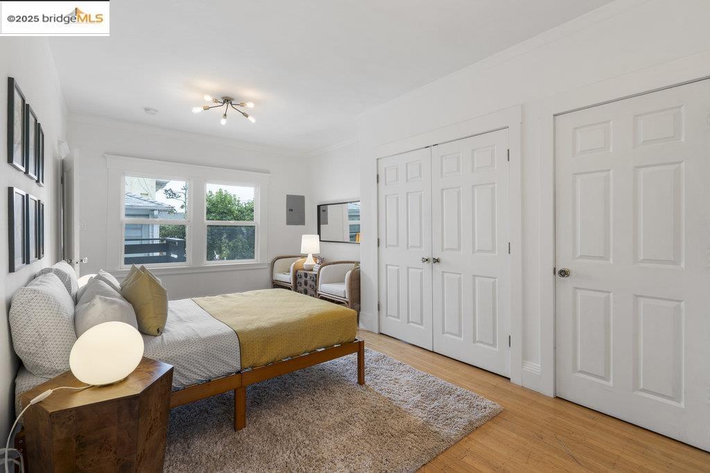 2587 Piedmont Avenue, Unit 3 Berkeley, CA 94704 - Photo 22 of 33 a bedroom with a bed a chandelier and a window