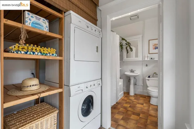 a view of a table and chairs in back yard of the house