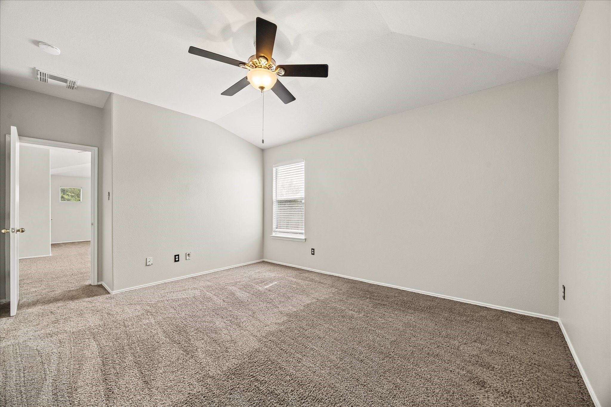 223 Sunset Colony Drive Rosharon, TX 77583 - Photo 27 of 50 One of three upstairs guest rooms, this inviting space feels comfortable from the start with soft carpet, fresh paint, a cooling ceiling fan and a large closet, plus easy access to the full bath.