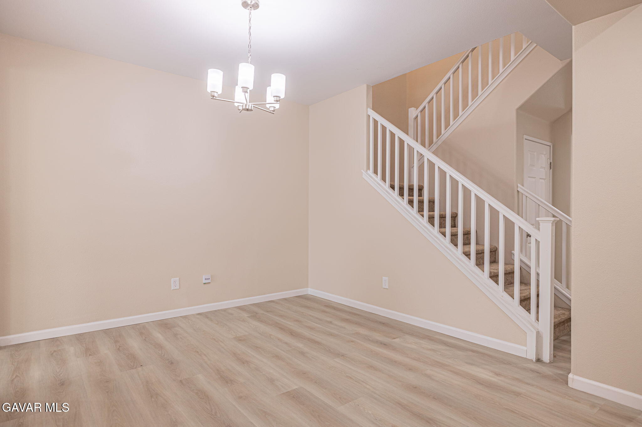 2834 Allessandra Court Lancaster, CA 93535 - Photo 14 of 51 a view of a hallway with wooden floor and staircase