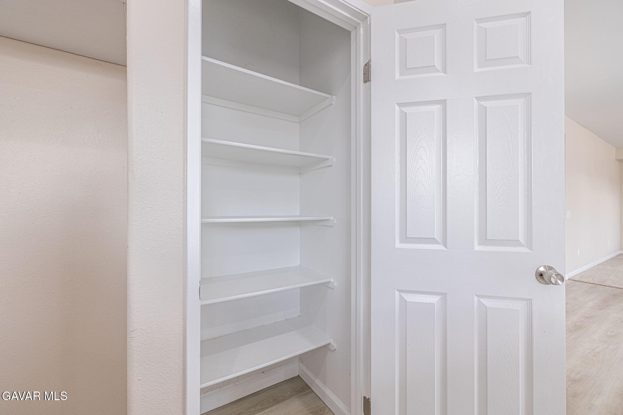 2834 Allessandra Court Lancaster, CA 93535 - Photo 28 of 51 a view of a hallway with white cabinets