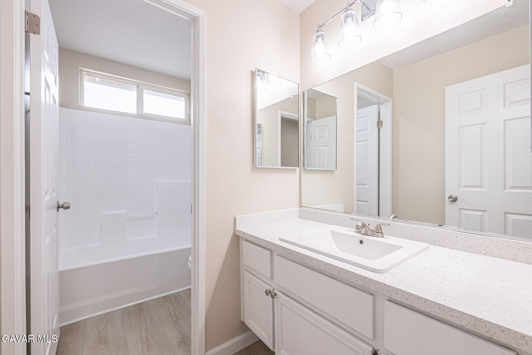 2834 Allessandra Court Lancaster, CA 93535 - Photo 42 of 51 a bathroom with a sink and a mirror