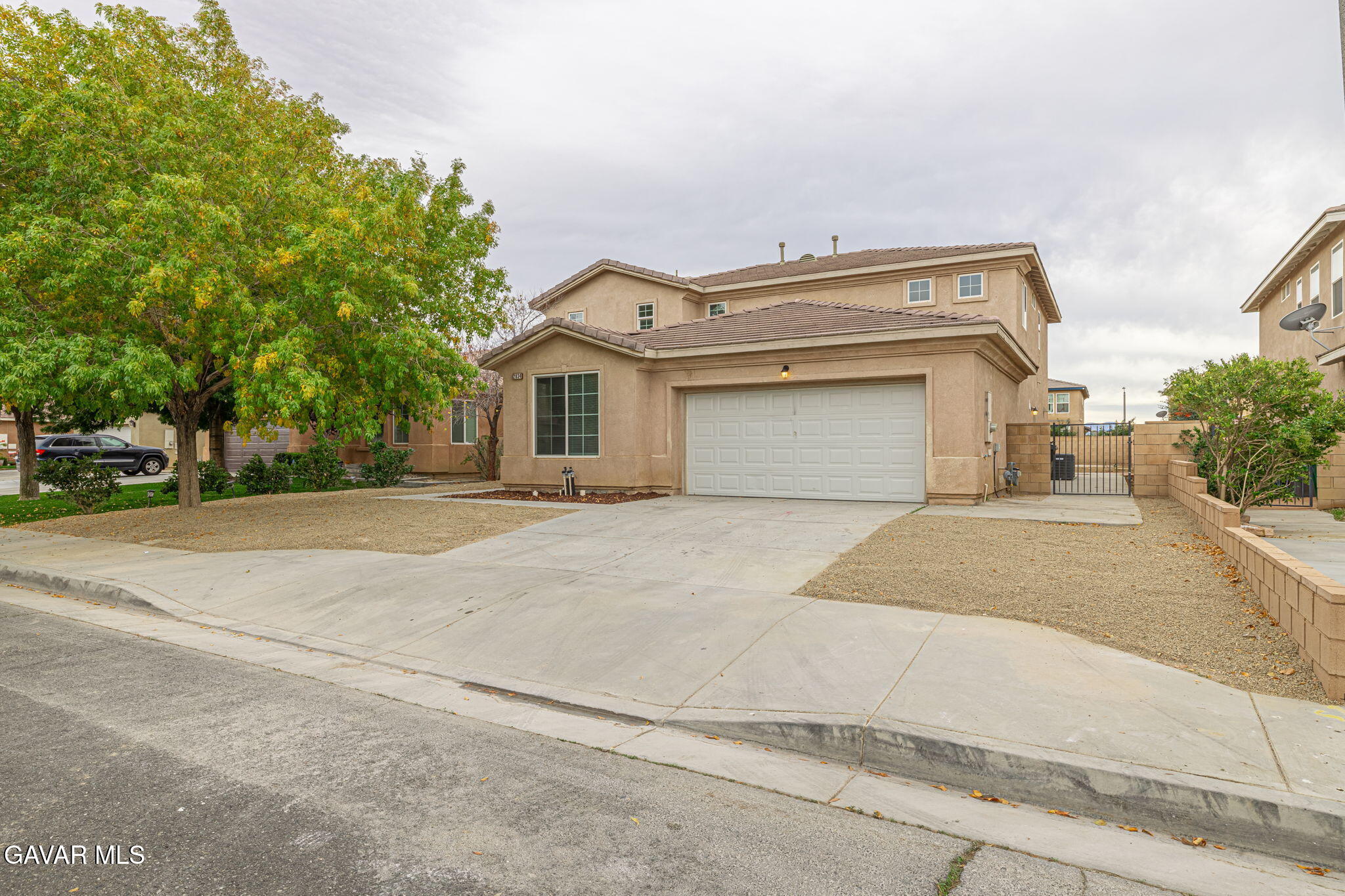2834 Allessandra Court Lancaster, CA 93535 - Photo 5 of 51 a front view of a house with a yard and garage