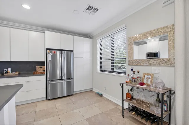 a kitchen with stainless steel appliances granite countertop a sink and cabinets
