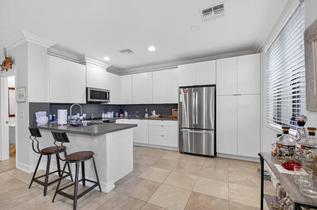 a view of entryway with wooden floor and stairs