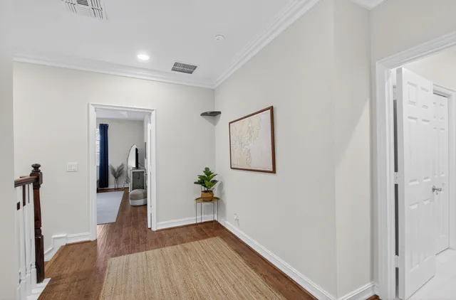 a bedroom with a bed dresser and a window