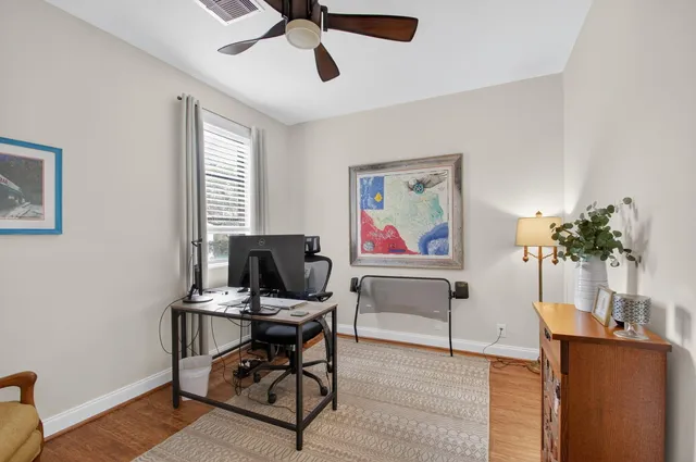 a workspace with furniture and rug