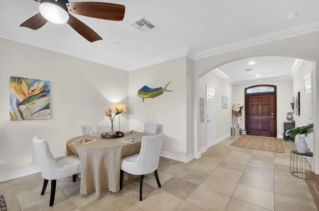 a dining room with furniture and window